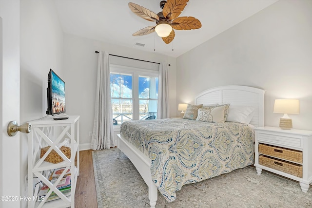 bedroom with hardwood / wood-style flooring and ceiling fan