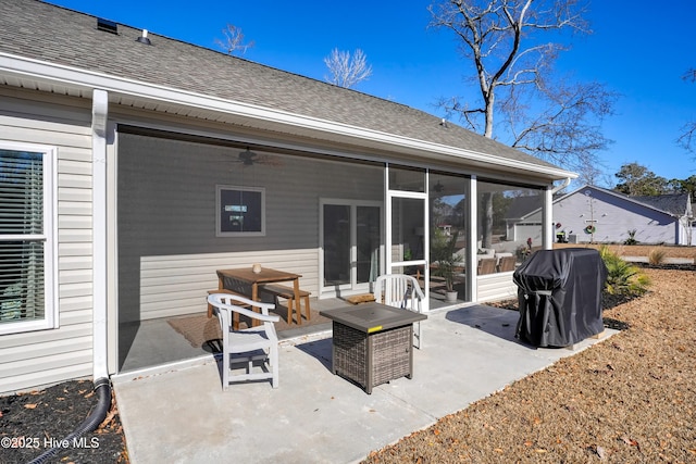 back of house featuring a patio area, a sunroom, and ceiling fan