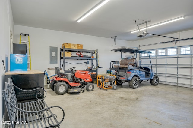 garage with electric panel and a garage door opener