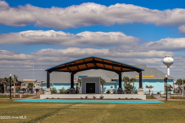 view of property's community with a gazebo and a lawn