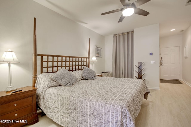 bedroom featuring ceiling fan and light hardwood / wood-style flooring