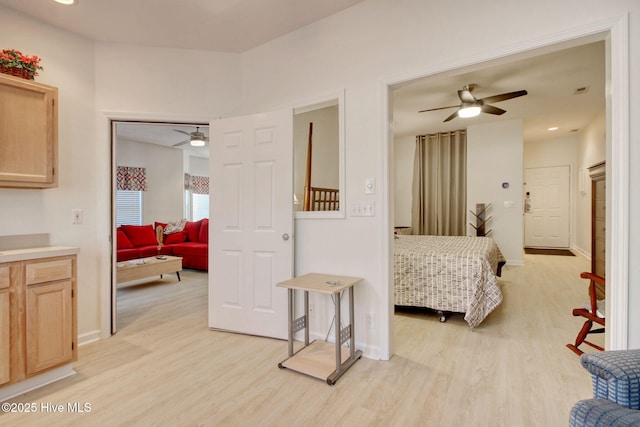 bedroom featuring ceiling fan and light hardwood / wood-style floors