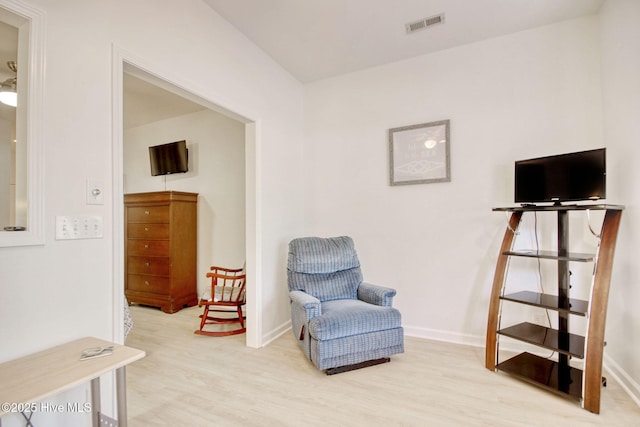 sitting room featuring light hardwood / wood-style floors