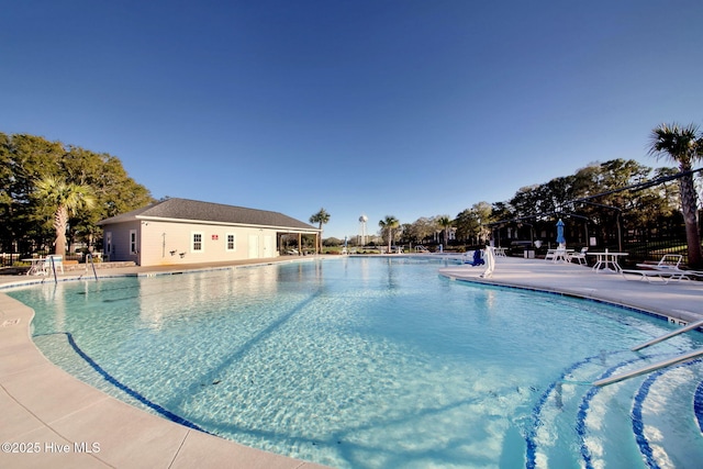 view of swimming pool with a patio area