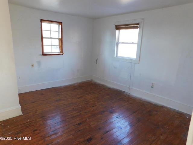 empty room featuring dark hardwood / wood-style floors