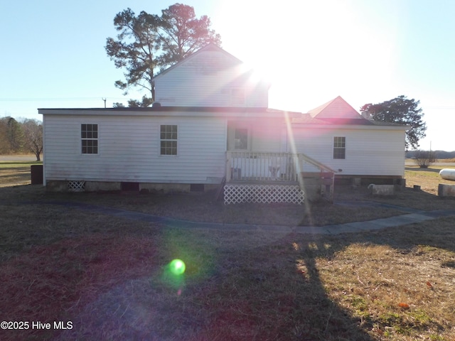 back of house with a yard