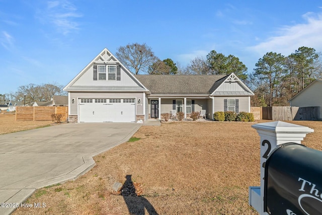 view of front facade with a front yard and a garage