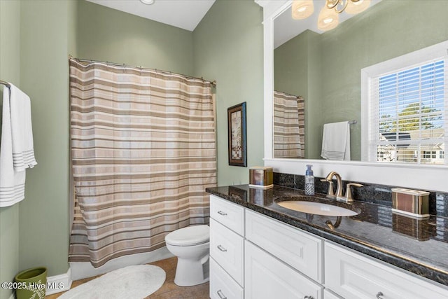 full bathroom with vanity, tile patterned flooring, toilet, and shower / tub combo with curtain