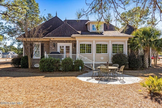 back of property with french doors and a patio