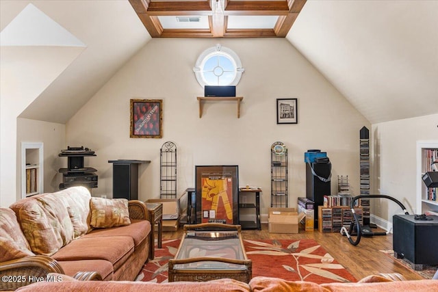 living room with hardwood / wood-style flooring and high vaulted ceiling