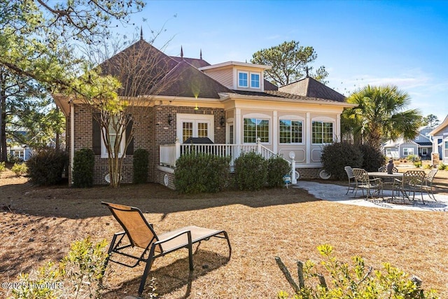 back of house with a patio area