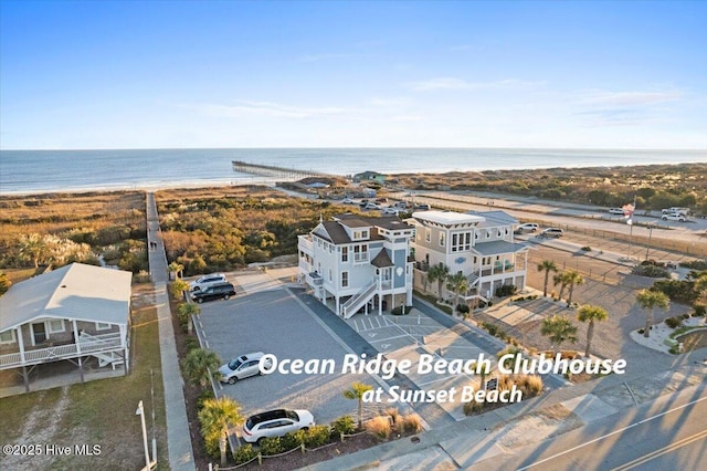 bird's eye view featuring a water view and a view of the beach