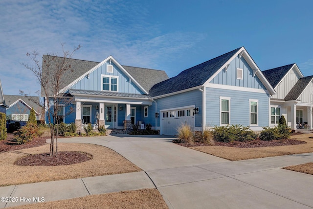 craftsman inspired home with covered porch and a garage