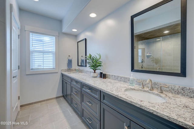 bathroom featuring tile patterned floors, vanity, and walk in shower