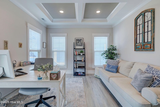 office area with light hardwood / wood-style floors, ornamental molding, beam ceiling, and coffered ceiling