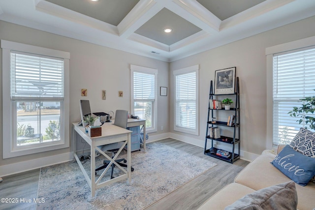 office with beam ceiling, a healthy amount of sunlight, coffered ceiling, and light wood-type flooring