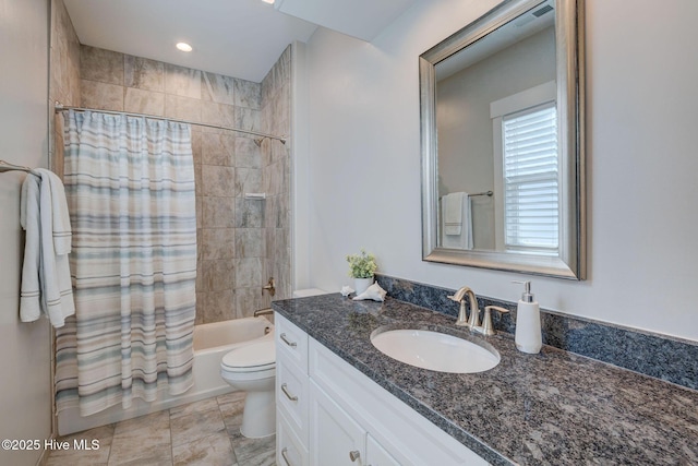 full bathroom with shower / bath combo, toilet, and vanity