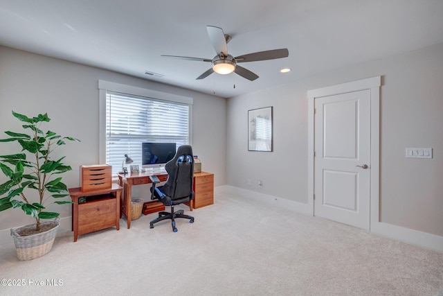 carpeted home office with ceiling fan