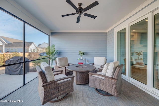 sunroom / solarium with ceiling fan