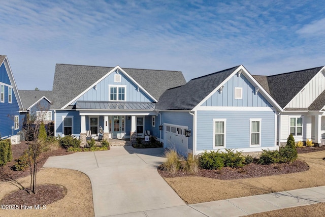 view of front of property with a porch and a garage