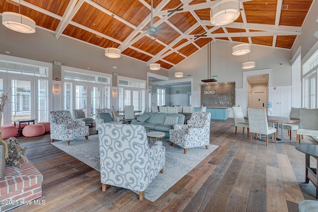 living room featuring dark hardwood / wood-style flooring, high vaulted ceiling, ceiling fan, and wood ceiling