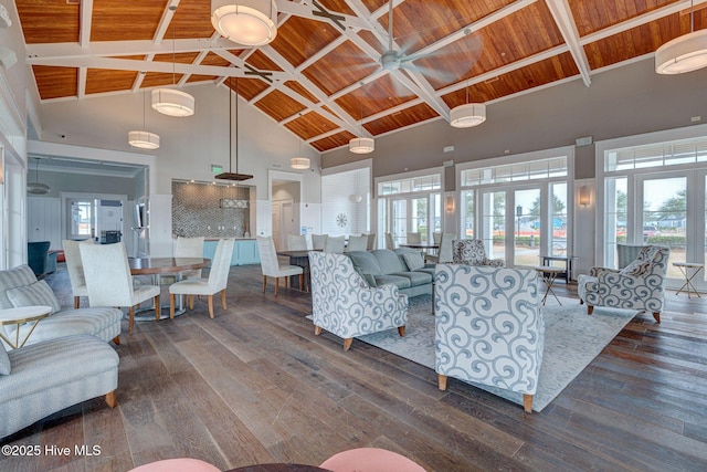 living room with french doors, dark wood-type flooring, high vaulted ceiling, beamed ceiling, and wood ceiling