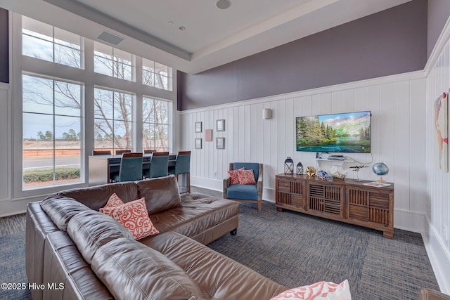 living room featuring dark colored carpet