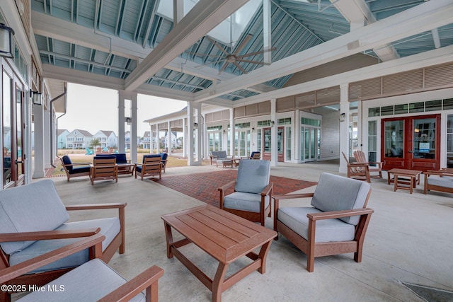 view of patio / terrace featuring french doors, an outdoor living space, and ceiling fan