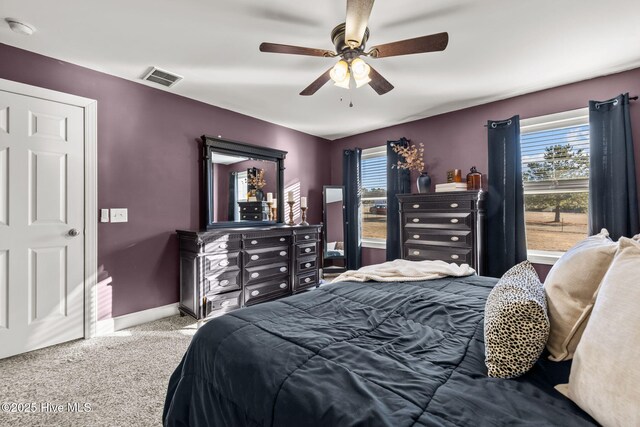 carpeted bedroom with ceiling fan