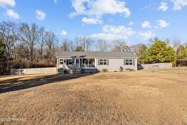 back of house featuring a yard