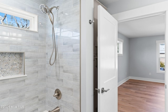 118 SE 9th St, Oak Island, NC 28465 - bathroom featuring baseboards, tub / shower combination, and wood finished floors