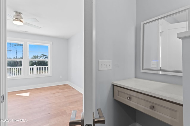 118 SE 9th St, Oak Island, NC 28465 - bathroom featuring baseboards, a ceiling fan, and wood finished floors