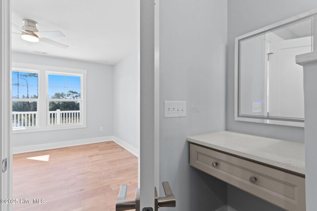 118 SE 9th St, Oak Island, NC 28465 - bathroom featuring wood finished floors and ceiling fan