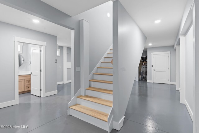 118 SE 9th St, Oak Island, NC 28465 - stairway featuring recessed lighting, finished concrete flooring, and baseboards