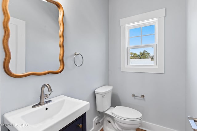 half bath with vanity and toilet