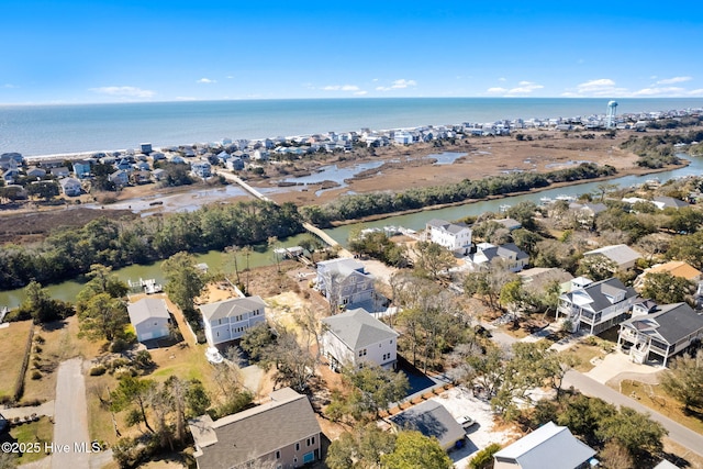 drone / aerial view featuring a residential view and a water view