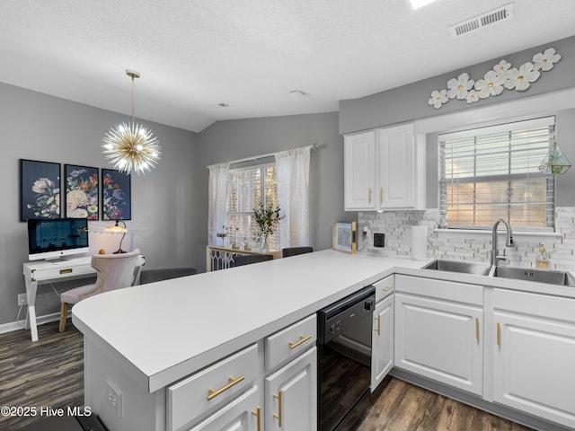 kitchen with kitchen peninsula, white cabinetry, dishwasher, and sink