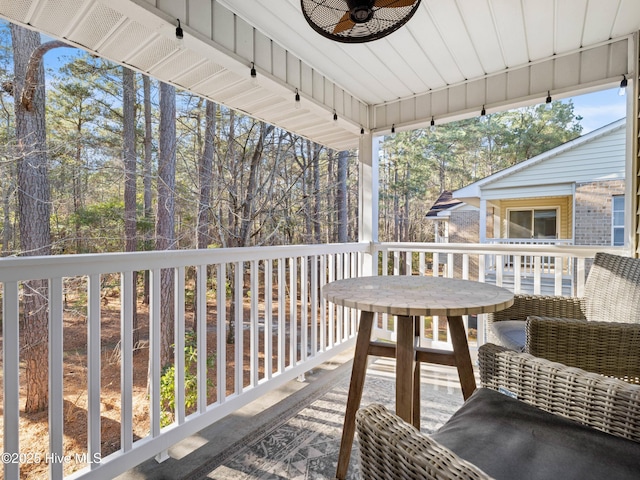 wooden terrace with ceiling fan