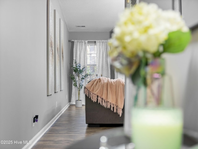 bedroom with dark wood-type flooring