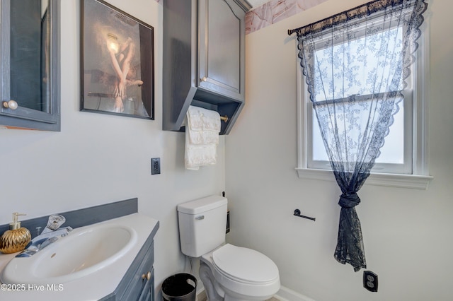 bathroom featuring vanity and toilet