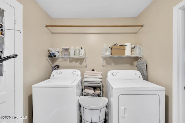 laundry room with washing machine and dryer