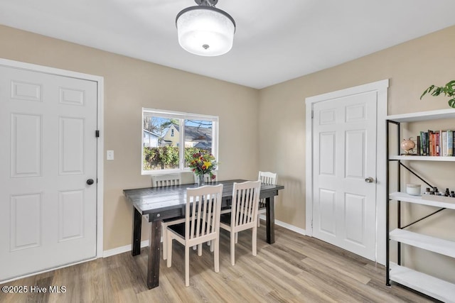 dining room with light wood-type flooring