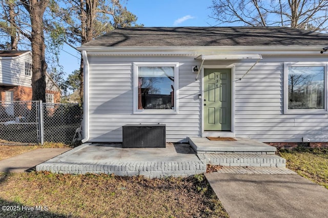 doorway to property featuring central AC and a patio area