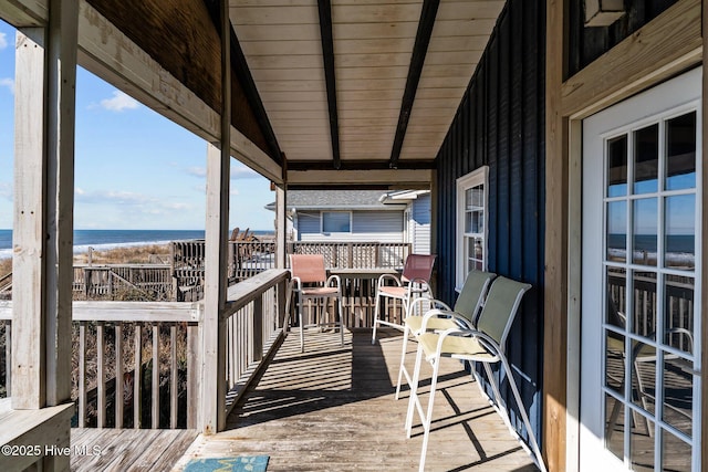 balcony with a deck with water view