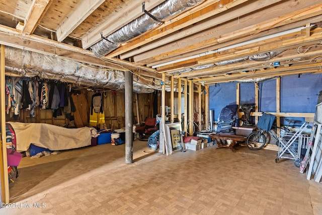 basement featuring parquet flooring