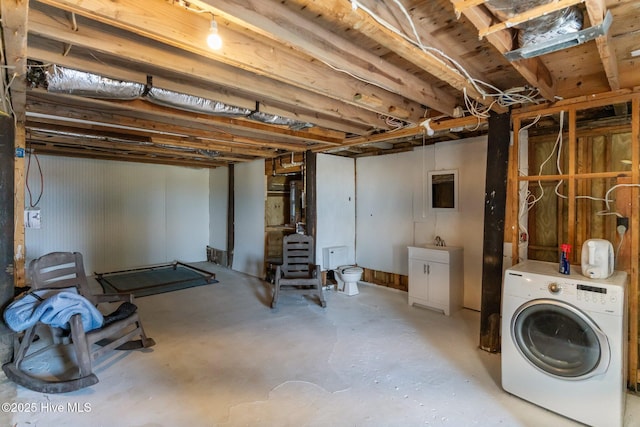 unfinished below grade area with washer / dryer