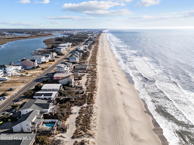 bird's eye view with a view of the beach and a water view