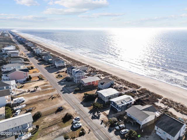 birds eye view of property featuring a water view and a view of the beach