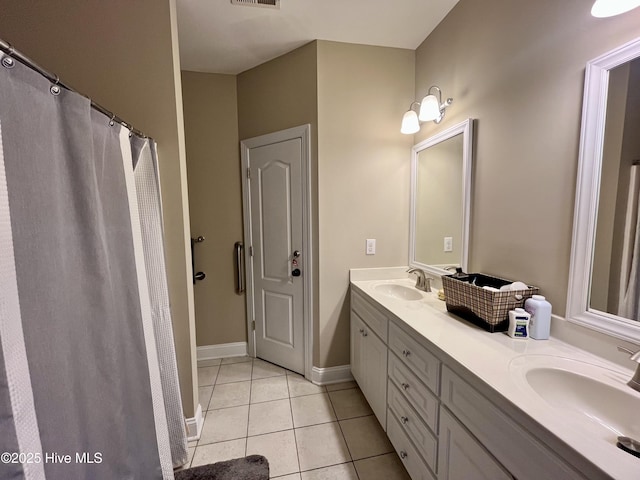 bathroom featuring tile patterned floors and vanity