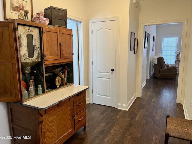 hallway featuring dark hardwood / wood-style flooring